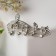 Brooch "Notes" melody, white color in silver