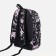 A backpack with a zipper, 3 external pockets, pink/black color