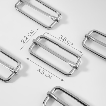 The buckle is regulatory, the inner width is 38 mm, the thickness is 3.5 mm, the color is silver
