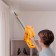 Vacuum cleaner KitFort KT-5251, vertical, 120 watts, 0.8 l, orange