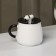 Ceramic mug with a lid and spoon "Panda", 450 ml, white and black color