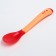 A spoon for feeding, thermal sensitive, red-beige color