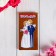 Wooden envelope carved "Tip and love!" newlyweds
