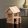 The designer is a wooden “House with a veranda”, 102 details, an array of beech