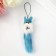 Fluffing on a pendant with colored bells mix