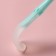 A set of silicone spoons for feeding, 2 pcs., In a container, the color is turquoise