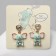 Emall earrings "Elephants" with hearts, colored in silver