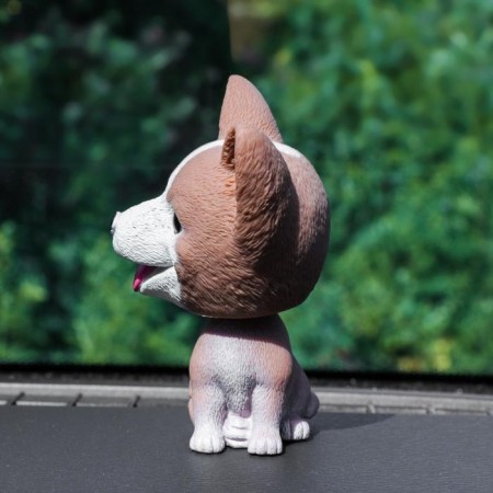Dog on a car panel shocking his head, jusk, brown-1