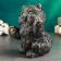 The piggy bank "joyful cat" is black, gold, 20cm