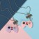 Kulons "Demetrons" game joysticks, lilac-pink color in silver, 45 cm