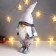 Interior doll "Santa Claus in a white-pearl cap and a vest with sequins" 55x16x22 cm 62601