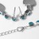 Set 4 objects: earrings, necklaces, bracelet, “heart” ring in circles, blue color in silver