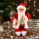 Santa Claus "in a patterned vest, with gifts" moves, with a backlight, 24 cm, red