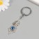Keychain from the evil eye metal "feather" 2.7x7 cm