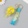 A keychain plastic with a carbine, a strap "Yellow" Water with decor1.8x5.3x5.6 cm