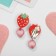 Clips children's “chosen” vitamins, strawberries with beads, colored
