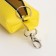 Key of zipper, length 16 cm, ring, carbine, yellow color