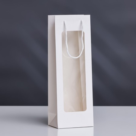 A package for a bottle with a plastic window 12.5 × 8.5 × 36 cm, white