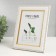 Photo frame plastic 13x18 cm "Golden waves and points" white 16.6x21.6 cm