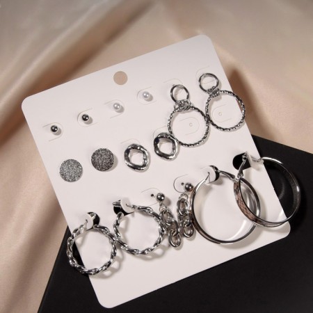 Earrings set of 8 pairs “Classes” Snake pattern, brown color in silver, D = 4-1