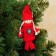 Toy - suspension "Doll in a suit", red color, mix