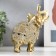 Souvenir Polystone "Golden Elephant with a Popone of Beads with bells" MIX 15x14.5x7.7 cm