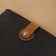 The fastener is sewn for a bag, on a button, made of genuine leather, 13.5 × 2.5 cm, brown/silver color