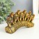 Polystone souvenir "Five elephants on a tusk with flowers" bronze 17x4x8 cm
