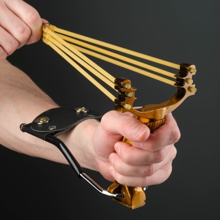 A slingshot with a plastic handle, with an emphasis-4