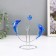 Dolphins pendulum opposite each other with a ball of 9 x 15 x 19.5 cm