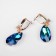 Earrings with rhinestones "Illusion" drop on oval, white-blue color in gold