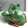 Souvenir Polystone stand "Frog with flowers" aged green 18x26 cm