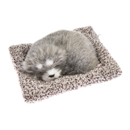 Toy on a car panel, a dog on a pillow, gray color