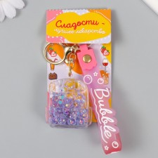 A plastic keychain with a carbine, a strap of 
