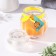 Aromatic candle in the bank "pot", orange, 9x7.5cm