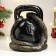 The piggy bank "Snake with weights" is black, 25 cm