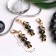 Charm "Bunny", black and white color in gold