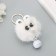Fluffy on the ring "Star eyes with a bell" white 8.5x6x6 cm