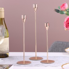 A set of 3 candlesticks, metal, d = 8 cm h = 24/29/34 cm