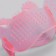 Rubber massage brush on hand, pink