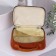 Cosmetic bag with a lining, brown color