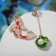 Emall Earms "Night" fish with a shell, the color is red-green in gold