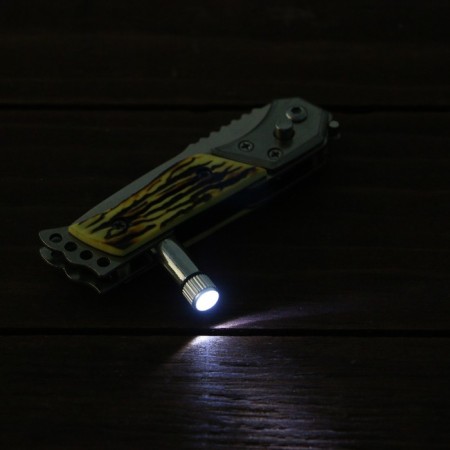 A folding semi -automatic "pescar", a 6cm blade, with a flashlight, an elephant. bone-4