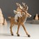Souvenir Polystone "Baby-Angel in a gray outfit, riding on a deer" 5.5x14x14.5 cm