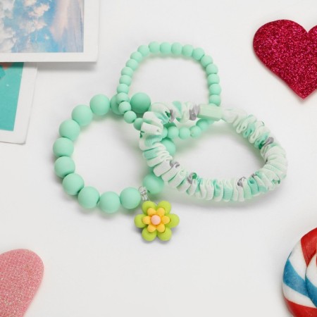 The kit of children's “chosen” 3 objects: elastic band, 2 bracelets, flower, mint color-1