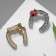 Brooch "Horseshoe" for good luck with God's cow, color mix