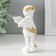 Polystone souvenir "Snowty angel scatters gold roses" 6.5x4x11 cm