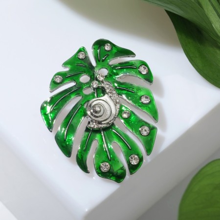 Brooch "Monster sheet" with a snail, the color is green and white in silver