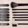 A set of makeup brushes, 7 objects, a cover on the ties, the color is black