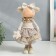 Interior doll "Baby with a bow in hair, with a flower" 35x13.5x20 cm